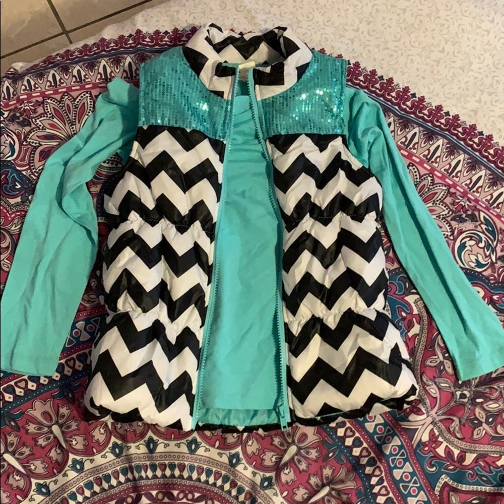 A long sleeve shirt with a cute vest on top
